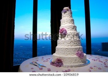 Beautiful wedding cake at a wedding reception looking out over city