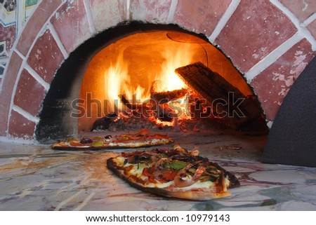 an image of Pizza fresh out of a wood burning oven