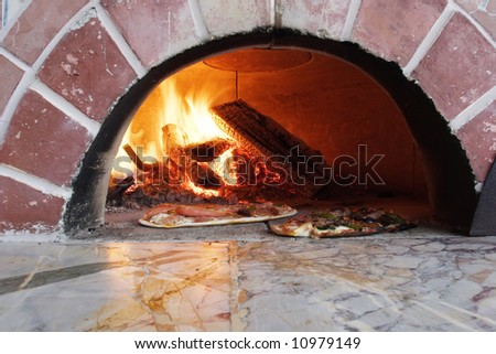 pizza in a wood burning pizza oven