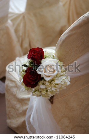 stock photo an image of Wedding flowers in a church at the end of the