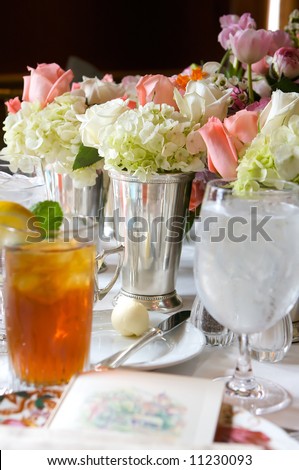 an image of a flower center piece on a sun drenched table