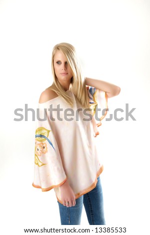 Model in jeans and water color tunic with flowing sleeves