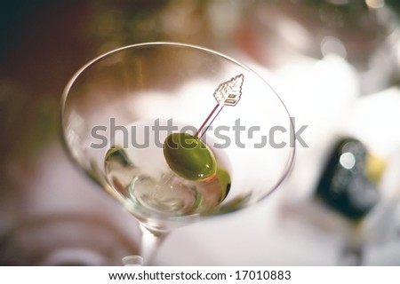 An image of a vodka martini with an olive garnish