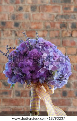 stock photo A colorful purple bridal bouquet of flowers