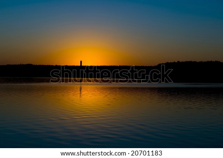 An image of a lake at sun down