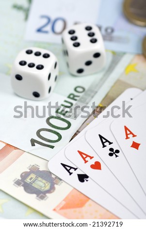 Playing cards and dices over european currency