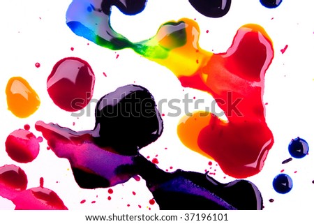 Cyan magenta yellow and black watercolor droplets and spots over white background