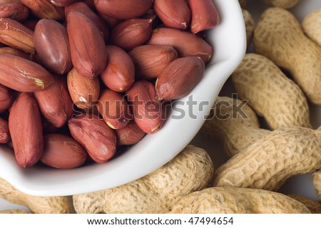 Close up image of roasted peanuts and peanut shells