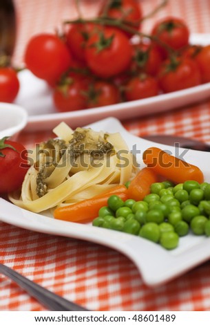 Vegetarian fettuccine pasta with peas and carrots