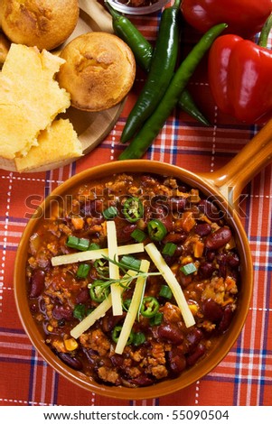 Traditional mexican chili beans con carne served with corn bread