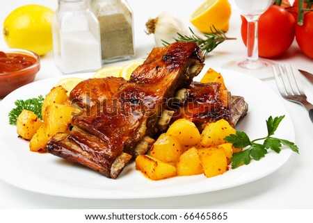 Honey glazed barbecued ribs with baked potato