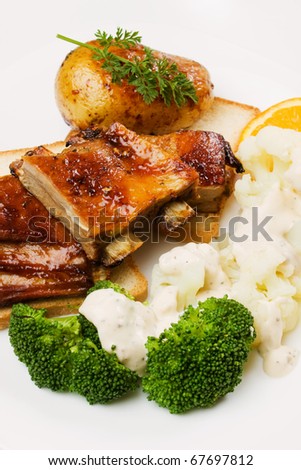 Barbecued honey glazed ribs with cauliflower and broccoli