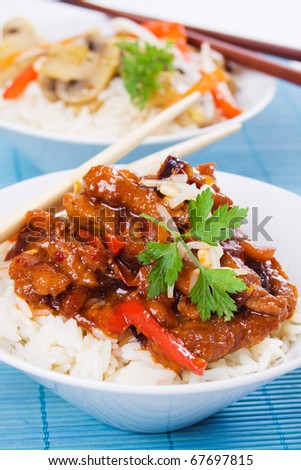 Chinese pork with peanuts served over cooked rice