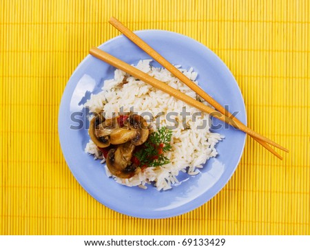 Asian cooked rice with champignon mushrooms and vegetable
