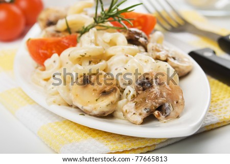 Champignon mushrooms with italian funghetti pasta in white sauce