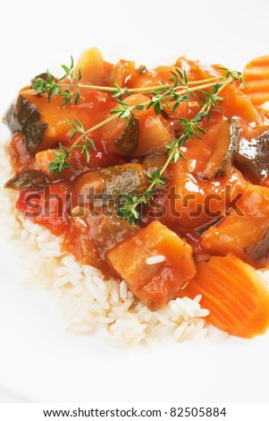 Zucchini, carrot and other vegetable in ratatouille with cooked rice