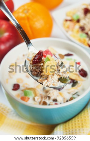 Cereal muesli breakfast with dried fruit in spoon