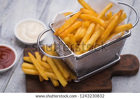 Home made french fries served in frying basket