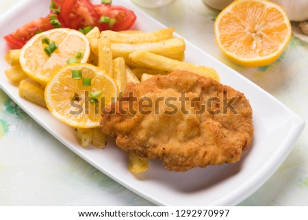 Vienna steak, breaded and deep fried cutlet with french fries