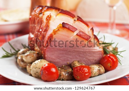 Roasted christmas ham with mushrooms and vegetables