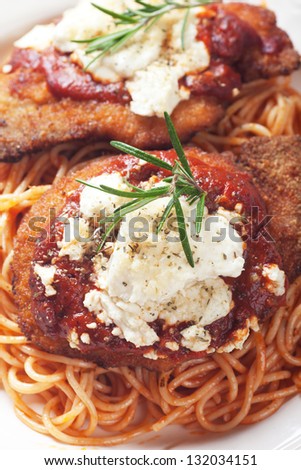 Chicken parmesan, breaded chicken steak with tomato sauce and spaghetti pasta