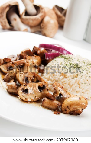 Grilled portabello mushrooms served with cooked rice