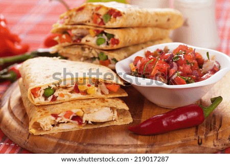Mexican quesadillas with chicken meat cheese and vegetables Mexican quesadillas with chicken meat cheese and vegetables