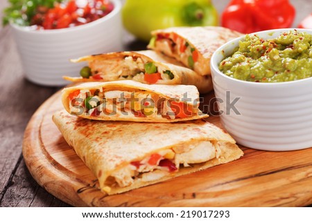 Mexican quesadillas with chicken meat, cheese and vegetables