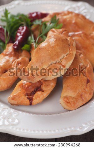 Baked empanadas, popular Latin American food served as snack or appetizer
