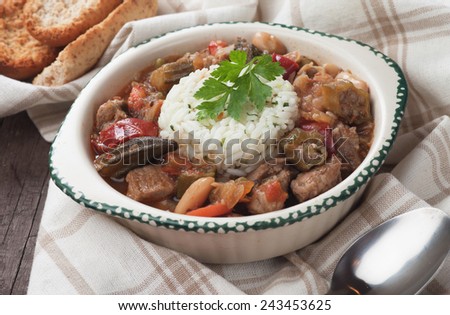 Pork and okra gumbo, cajun style stew served with cooked rice