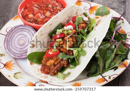 Mexican tortilla wrap, burrito with chili, beans and ground beef