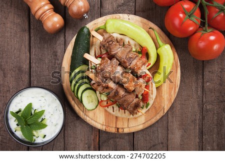 Souvlaki or kebab, meat skewer with pita bread and fresh vegetable