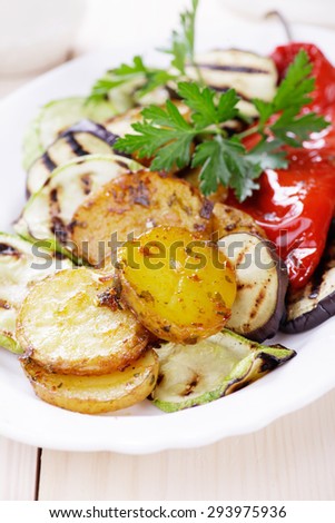 Oven baked spicy potato with grilled vegetables, healthy vegan meal