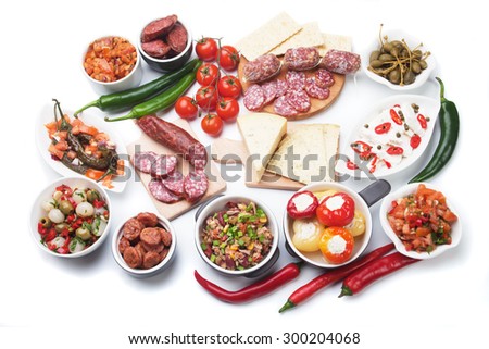 Tapas, antipasto or meze, traditional mediterranean cold buffet food isolated on white background