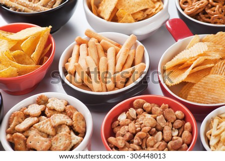 Grissini sticks, potato chips and other salty snacks