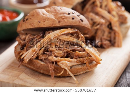 Pulled pork meat sandwich in whole grain burger bun