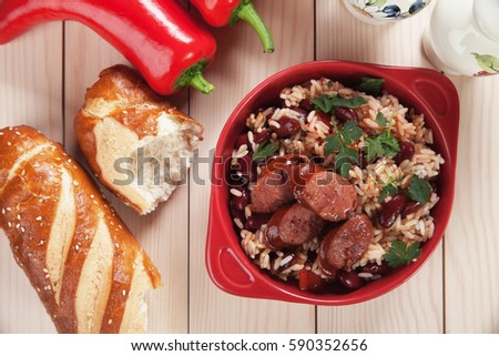 Rice and beans, staple food meal with sausage slices