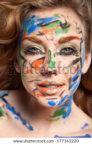 girl with color face art, perfect skin and hair. fashion portrait. female face.