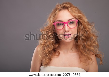 Excited woman looking. Closeup of happy female business woman in red glasses