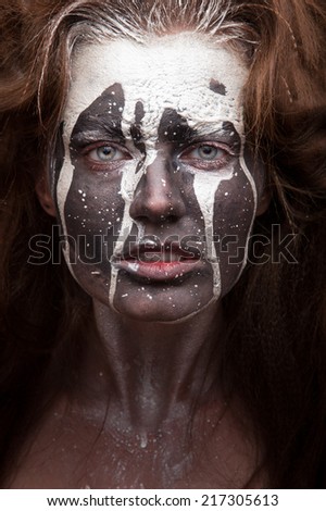 woman portrait with flowing white paint and dark face art