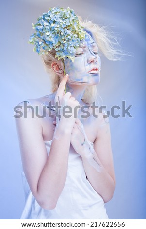 beauty woman with face art and flowers