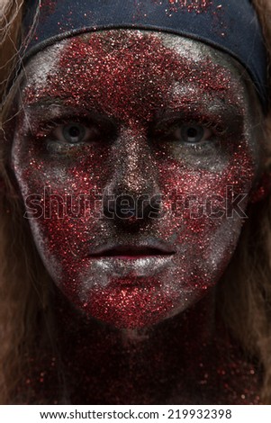 Creepy female demon with face art