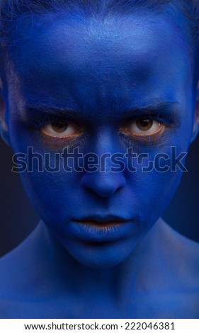 art photo of a beautiful woman with dark blue face