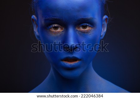 art photo of a beautiful woman with dark blue face