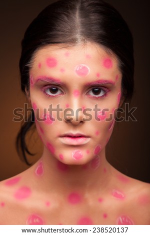 Sexy woman with cherry face art. Paint face portrait.