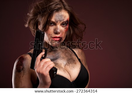 Beautiful, hot and sexy woman with gun. Riot girl.