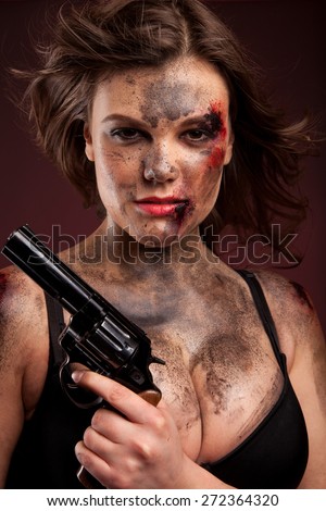 Beautiful, hot and sexy woman with gun. Riot girl.