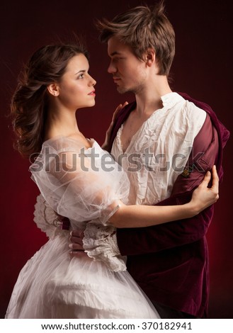 Beautiful couple woman and man in medieval clothes