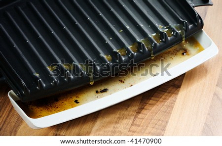 fat and oil flowing into drip tray dirty