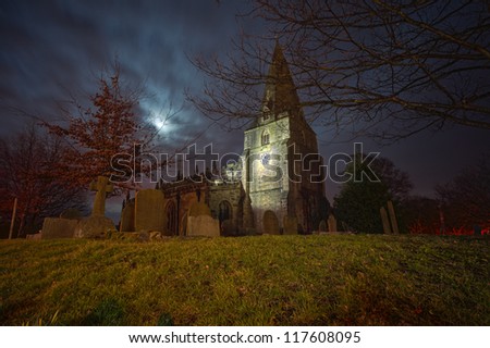 creepy church and cemetery at night